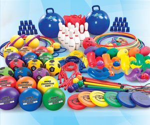 SPARK equipment shown includes a variety of balls, hoops, discs, bouncers, and more